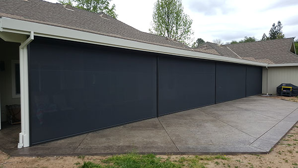 These Vertical Drop Screens keep the hot afternoon sun from reaching the house, keeping it cooler in Loomis, CA